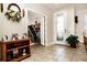 Well-lit entryway with a view into the home's interior and access to other rooms at 2117 Valterra Vista Way, Valrico, FL 33594