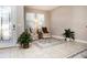 Bright and spacious entryway with tile flooring, natural light, and seating area at 2117 Valterra Vista Way, Valrico, FL 33594