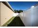 Narrow side yard with grassy area and privacy fence at 2117 Valterra Vista Way, Valrico, FL 33594