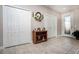 Front entry with tile flooring, coat closet, and access to other rooms at 2117 Valterra Vista Way, Valrico, FL 33594