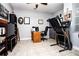 Home office space with a desk, treadmill, and built-in shelving at 2117 Valterra Vista Way, Valrico, FL 33594