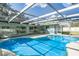 Inviting kidney-shaped pool with screened enclosure at 3275 Fox Hill Dr, Clearwater, FL 33761