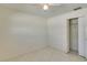 Simple bedroom with tile floors and a double door closet at 3275 Fox Hill Dr, Clearwater, FL 33761