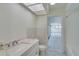 Bathroom with vanity and view of sunroom at 3275 Fox Hill Dr, Clearwater, FL 33761