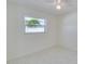 Bedroom with window and tiled floors at 3275 Fox Hill Dr, Clearwater, FL 33761