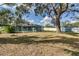 Large backyard with a pool, shed, and mature trees at 3275 Fox Hill Dr, Clearwater, FL 33761