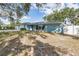 Ranch style home with a spacious yard and large oak trees at 3275 Fox Hill Dr, Clearwater, FL 33761