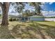 Spacious backyard featuring a screened pool and shed at 3275 Fox Hill Dr, Clearwater, FL 33761