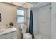 Clean bathroom with shower, toilet, and white tile at 3275 Fox Hill Dr, Clearwater, FL 33761