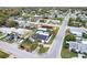 High angle aerial view of a residential neighborhood with waterways and lush landscapes at 4004 Claremont Dr, New Port Richey, FL 34652