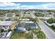 Aerial view of the property in a residential neighborhood with tree-lined streets at 4004 Claremont Dr, New Port Richey, FL 34652