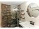 Modern bathroom featuring a stylish stone shower, floating shelves, and sleek fixtures at 4004 Claremont Dr, New Port Richey, FL 34652