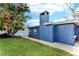 Charming home exterior with blue siding, well-manicured lawn, and a paved walkway at 4004 Claremont Dr, New Port Richey, FL 34652