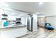 Modern kitchen with granite countertops, white cabinets, and stainless steel appliances at 4004 Claremont Dr, New Port Richey, FL 34652