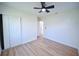 Bedroom with wood floors, double closet and bathroom access at 4011 Berkley Dr, Tampa, FL 33610