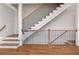 Close up of modern staircase with hardwood treads and a black metal railing, blending elegance with functionality at 407 S Albany Ave # 4, Tampa, FL 33606