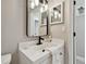 Modern bathroom with white vanity and black fixtures at 6338 8Th S Ave, Gulfport, FL 33707