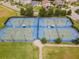 Well-lit tennis and basketball courts at 9157 Bella Vita Cir, Land O Lakes, FL 34637