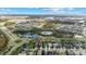 Wide aerial view of home and neighborhood from above at 9157 Bella Vita Cir, Land O Lakes, FL 34637