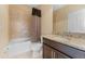 Clean bathroom with a shower/tub combo and granite vanity at 9157 Bella Vita Cir, Land O Lakes, FL 34637