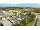 Aerial view of community, showcasing home and surrounding area at 9157 Bella Vita Cir, Land O Lakes, FL 34637