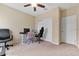 Home office featuring a desk, chair, and spacious closet at 9157 Bella Vita Cir, Land O Lakes, FL 34637