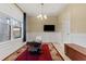 Dining room with a chessboard table and a TV at 9157 Bella Vita Cir, Land O Lakes, FL 34637