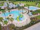 Community pool with water features and plenty of lounge space at 9157 Bella Vita Cir, Land O Lakes, FL 34637