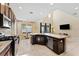 Kitchen with large island, high ceilings and breakfast nook at 9157 Bella Vita Cir, Land O Lakes, FL 34637