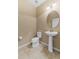 Powder room with pedestal sink and modern fixtures at 9157 Bella Vita Cir, Land O Lakes, FL 34637