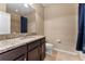 Bathroom with granite countertop and a shower/tub combo at 9157 Bella Vita Cir, Land O Lakes, FL 34637