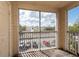 Screened balcony overlooking community parking lot at 18341 Bridle Club Dr, Tampa, FL 33647