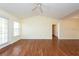 Spacious living room featuring wood floors and large windows at 18341 Bridle Club Dr, Tampa, FL 33647