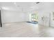 Bright and airy living room with light wood floors at 2214 Durant Rd, Valrico, FL 33596