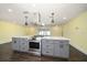 Kitchen island with white countertop and stainless steel appliances at 440 Mehlenbacher Rd, Belleair, FL 33756