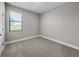 Bright bedroom with window and neutral carpet, offering a cozy feel at 12152 Snow Bird Ave, Port Charlotte, FL 33981