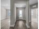 Inviting foyer with a front door and views of adjacent rooms with attractive flooring at 12152 Snow Bird Ave, Port Charlotte, FL 33981