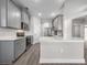 Stylish kitchen with gray cabinets, white countertops, and stainless steel appliances at 12152 Snow Bird Ave, Port Charlotte, FL 33981