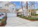 Attractive townhome exterior with two-car garage and lush landscaping at 14459 Mirabelle Vista Cir, Tampa, FL 33626