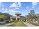 Elegant gated community entrance with lush landscaping and security features at 14459 Mirabelle Vista Cir, Tampa, FL 33626