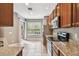 Bright kitchen with ample counter space and sliding door access to the backyard at 14459 Mirabelle Vista Cir, Tampa, FL 33626