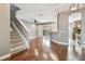 Living room with carpeted stairs, hardwood floors, and an open floor plan at 14459 Mirabelle Vista Cir, Tampa, FL 33626