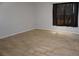 Bedroom featuring gray walls, wood floors and a dark curtain at 1801 E Navajo Ave, Tampa, FL 33612