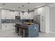 Modern kitchen with white cabinets and large island at 211 Dolphin Pt # 202, Clearwater Beach, FL 33767