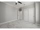 Spacious bedroom with marble floors and a double door closet at 211 Dolphin Pt # 202, Clearwater Beach, FL 33767