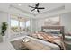 Spacious bedroom with water view and access to balcony at 211 Dolphin Pt # 202, Clearwater Beach, FL 33767