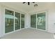 Covered balcony with sliding glass doors and water views at 211 Dolphin Pt # 202, Clearwater Beach, FL 33767