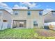 Exterior view of home featuring a screened-in patio and well-maintained lawn at 2122 Richwood Pike Dr, Ruskin, FL 33570