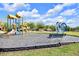 Community playground featuring slides, climbing structures, and bench, perfect for relaxation or watching play at 2122 Richwood Pike Dr, Ruskin, FL 33570