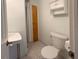 Clean bathroom with shower, toilet and pedestal sink at 218 6Th Sw Ave, Ruskin, FL 33570